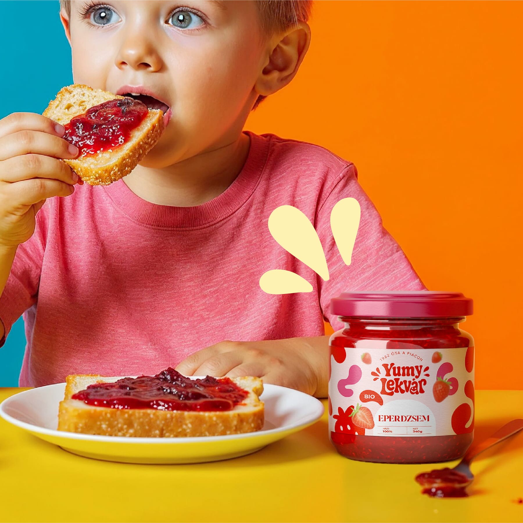 Child eating toast with Yumy Lekvár strawberry jam next to the jar: campaign visual by byannas